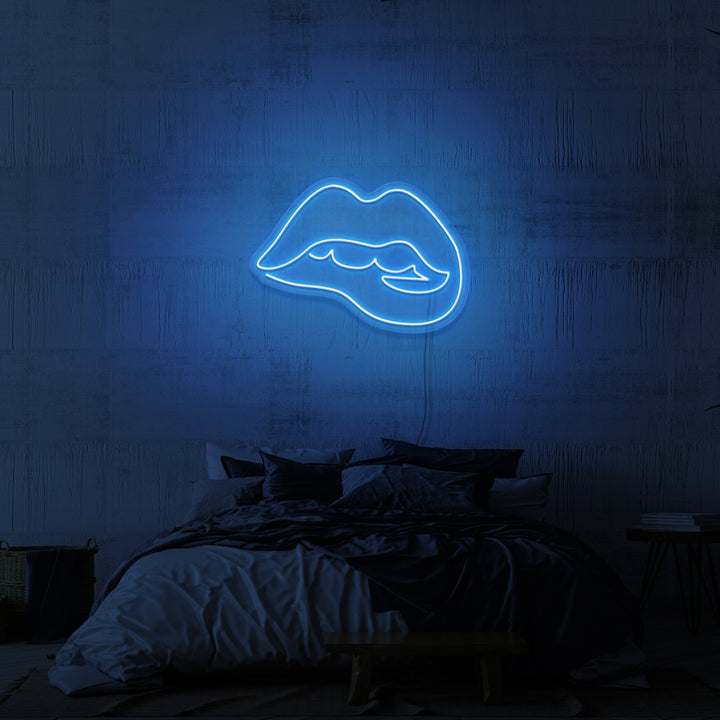 Leuchtreklame „Beißende Lippen“.