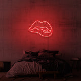 Leuchtreklame „Beißende Lippen“.