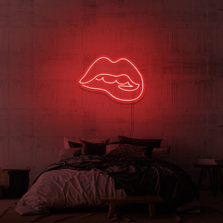 Leuchtreklame „Beißende Lippen“.
