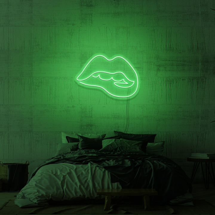 Leuchtreklame „Beißende Lippen“. 