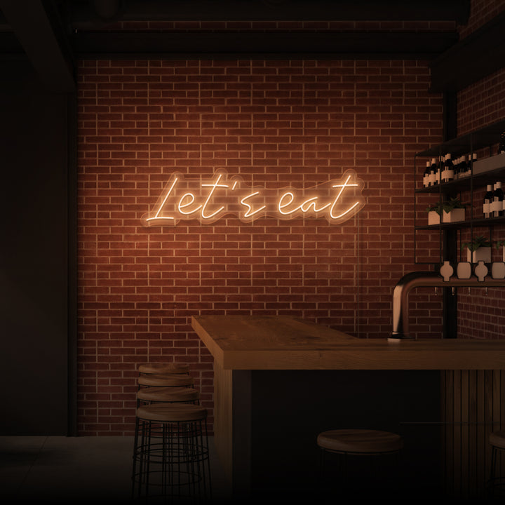 „LASST UNS ESSEN“ NEONSCHILD 