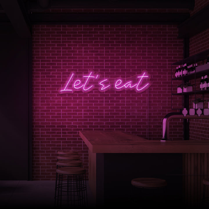 „LASST UNS ESSEN“ NEONSCHILD 